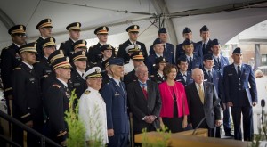The new military officers gather for a group photo with Medal of Honor recipient Thomas Kelley and President Leshin (bottom row center).