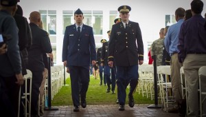ROTC cadets Brent Young (Air Force) and Taylor Powers (Army) lead the formation of cadets marching to the stage.