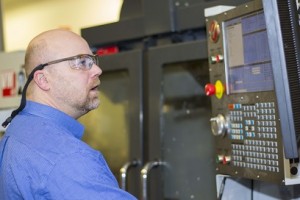Toby Bergstrom also works with the Massachusetts Manufacturing Extension Partnership to teach unemployed workers to use equipment in WPI’s manufacturing lab.
