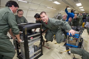 Jamal Yagoobi, second from left, with PhD student Viral Patel and two colleagues from NASA-Goddard, with experimental rack during a zero-gravity flight in 2013.