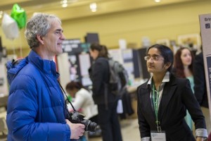Yashaswini Makaram discusses her winning project with a visitor.