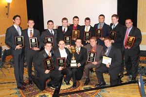 Members of Phi Kappa Theta display awards at ceremony.