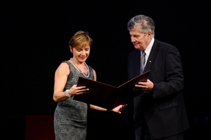 Tanja Dominko receives the Slovenian Ambassador of Science Award from Tadej Bajd, vice president of the Slovenian Academy of Sciences and Arts.