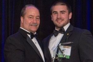 Wiegman, right, receives the Undergraduate Award of Distinction from NIC chairman Buddy Coté