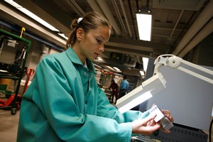 A graduate student examines a new alloy in the WPI Aluminum Casting Research Center