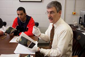 Professor Joel J. Brattin in the Gordon Library archives teaching students about Dickens and serialized fiction.